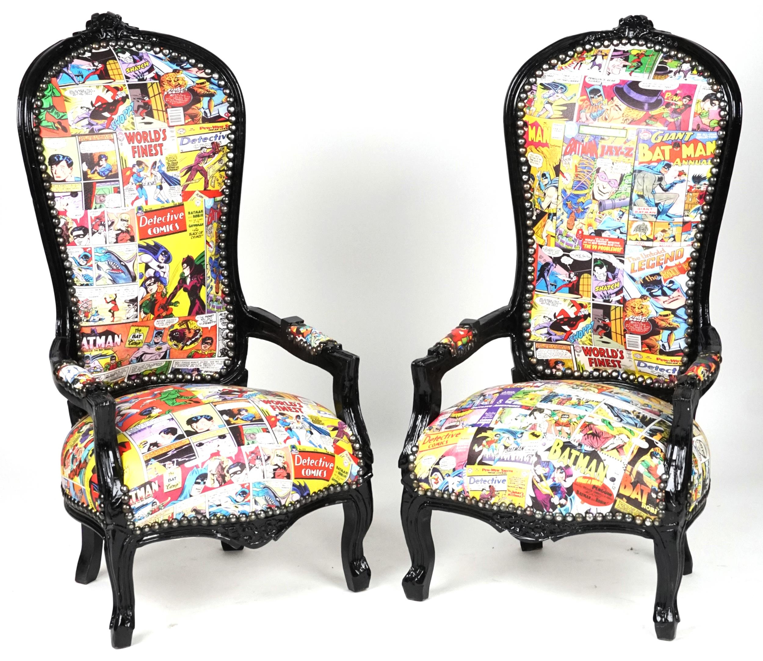 Pair of ebonised child's elbow chairs with comic upholstery, 100cm high