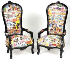 Pair of ebonised child's elbow chairs with comic upholstery, 100cm high