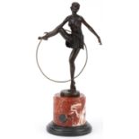 After D'Alonzo, patinated bronze statuette of a semi nude Art Deco female dancer raised on a