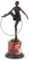 After D'Alonzo, patinated bronze statuette of a semi nude Art Deco female dancer raised on a