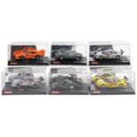 Six Carrera Evolution slot cars with cases comprising Porsche 935, Aston Martin V12 Vanquis, Audi A4