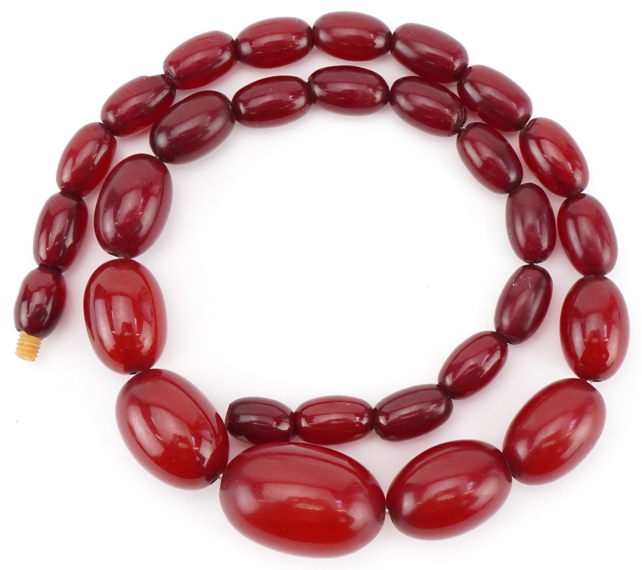 Cherry amber coloured graduated bead necklace, the largest bead approximately 25mm x 17mm in - Image 2 of 2