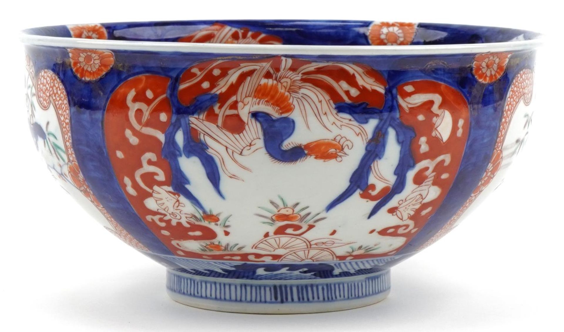 Japanese Imari porcelain bowl hand painted with panels of flowers, 25cm in diameter