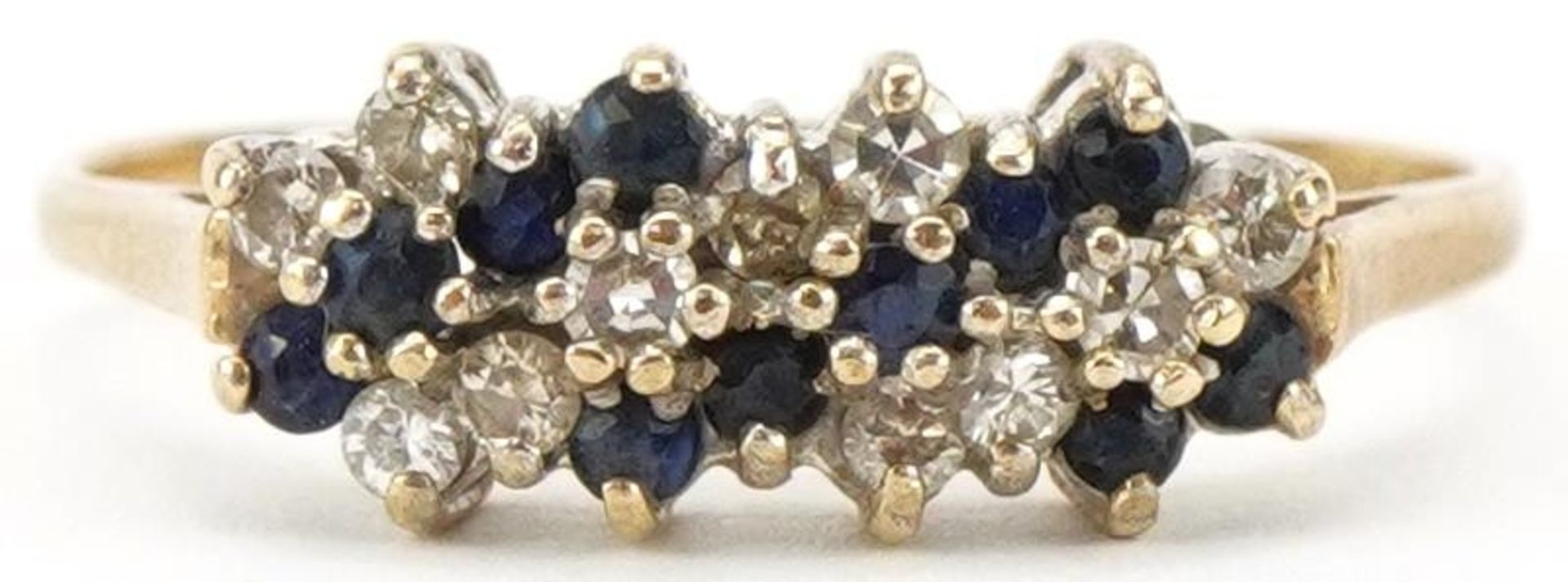 9ct gold diamond and sapphire six row cluster ring, size Q/R, 1.6g