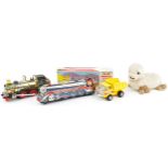 Battery operated tinplate Silver Mountain Flash train, a similar train, Yellow Tonka dumper and a