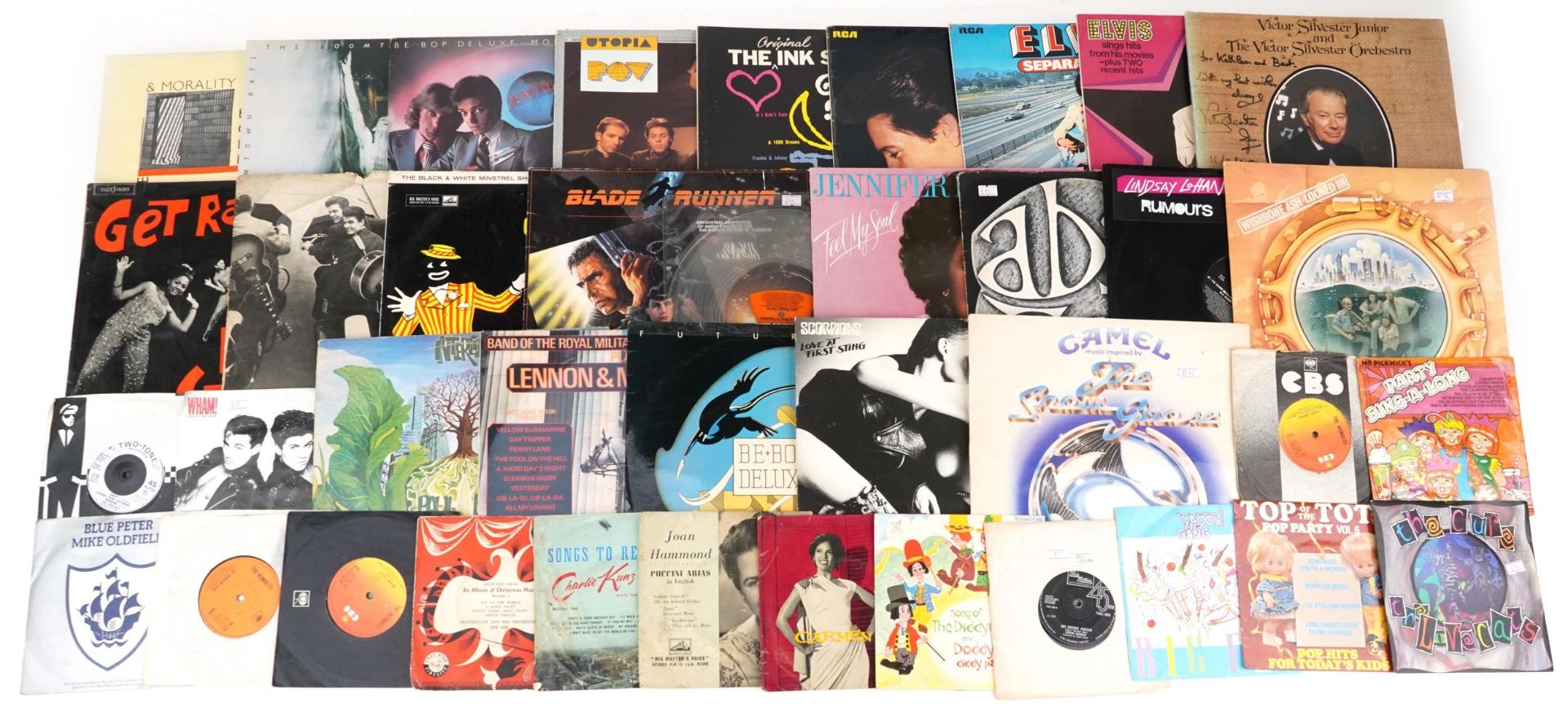 Vinyl LP records and 45rpms including The Boom Town Rats, Utopia, Elvis Presley, Camel, Futurama,