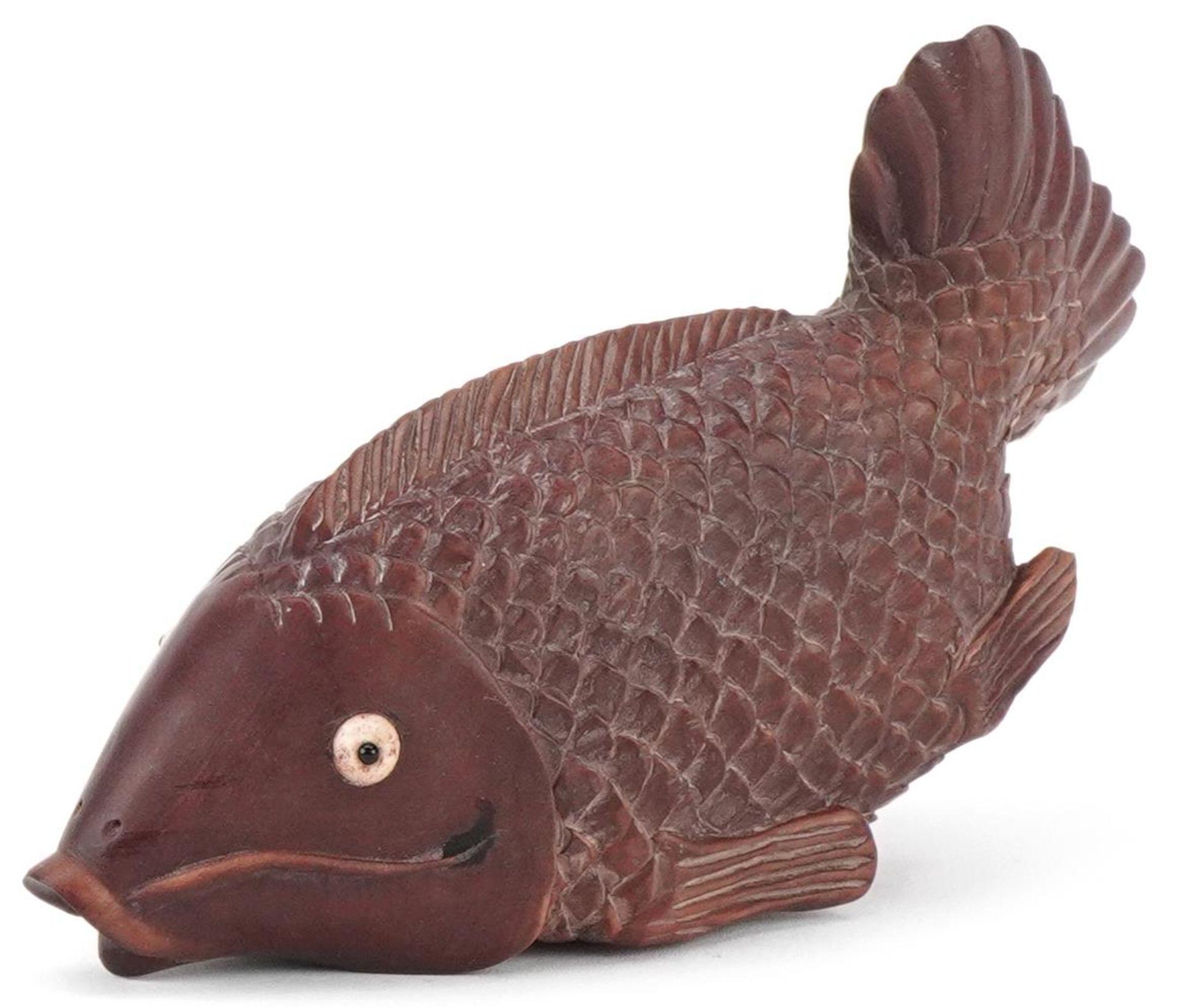 Japanese carved hardwood inro in the form of a fish, 13cm in length