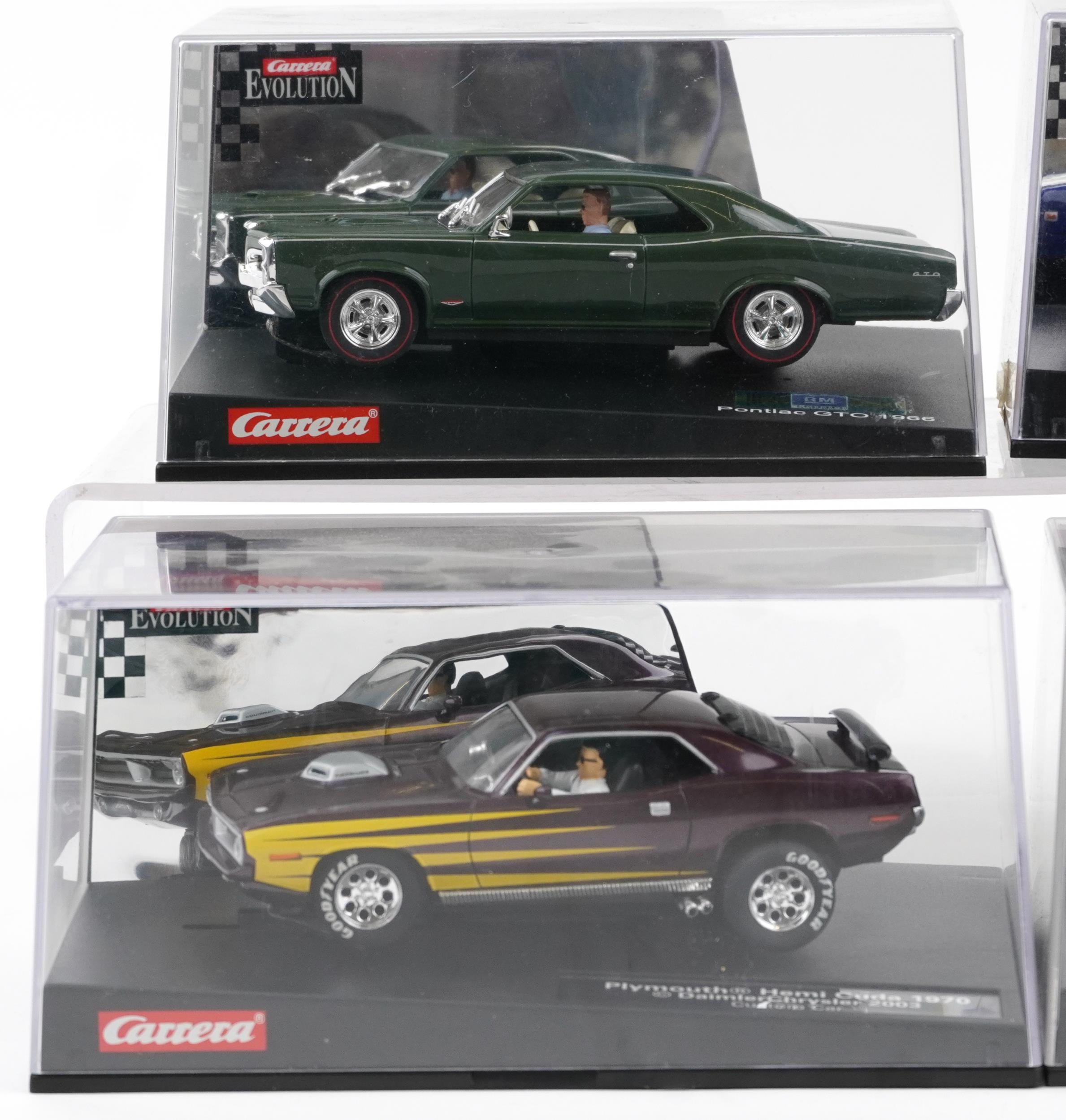 Six Carrera Evolution slot cars with cases comprising Dodge Charger 500, Porsche Carrera GT, - Image 2 of 3