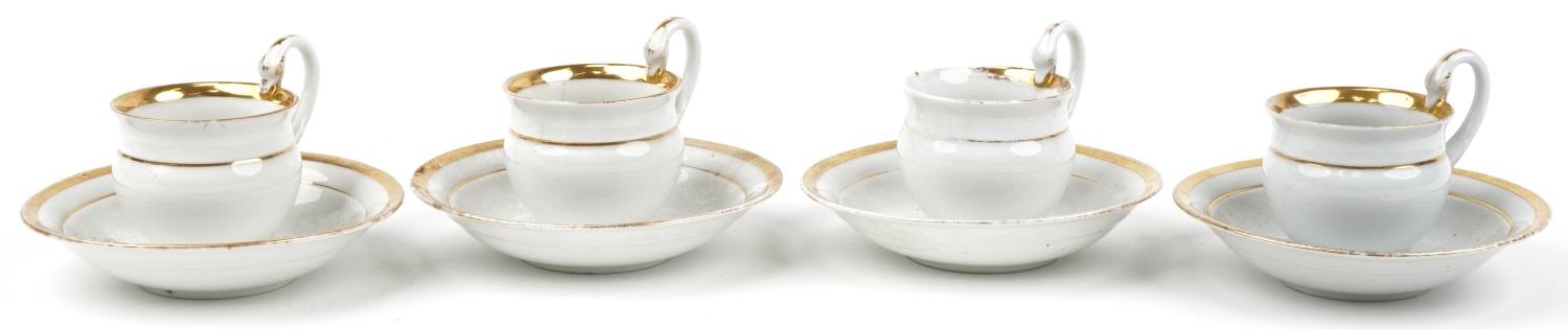 Four Meissen porcelain chocolate cups and saucers with swan neck handles each saucer 14.5cm in