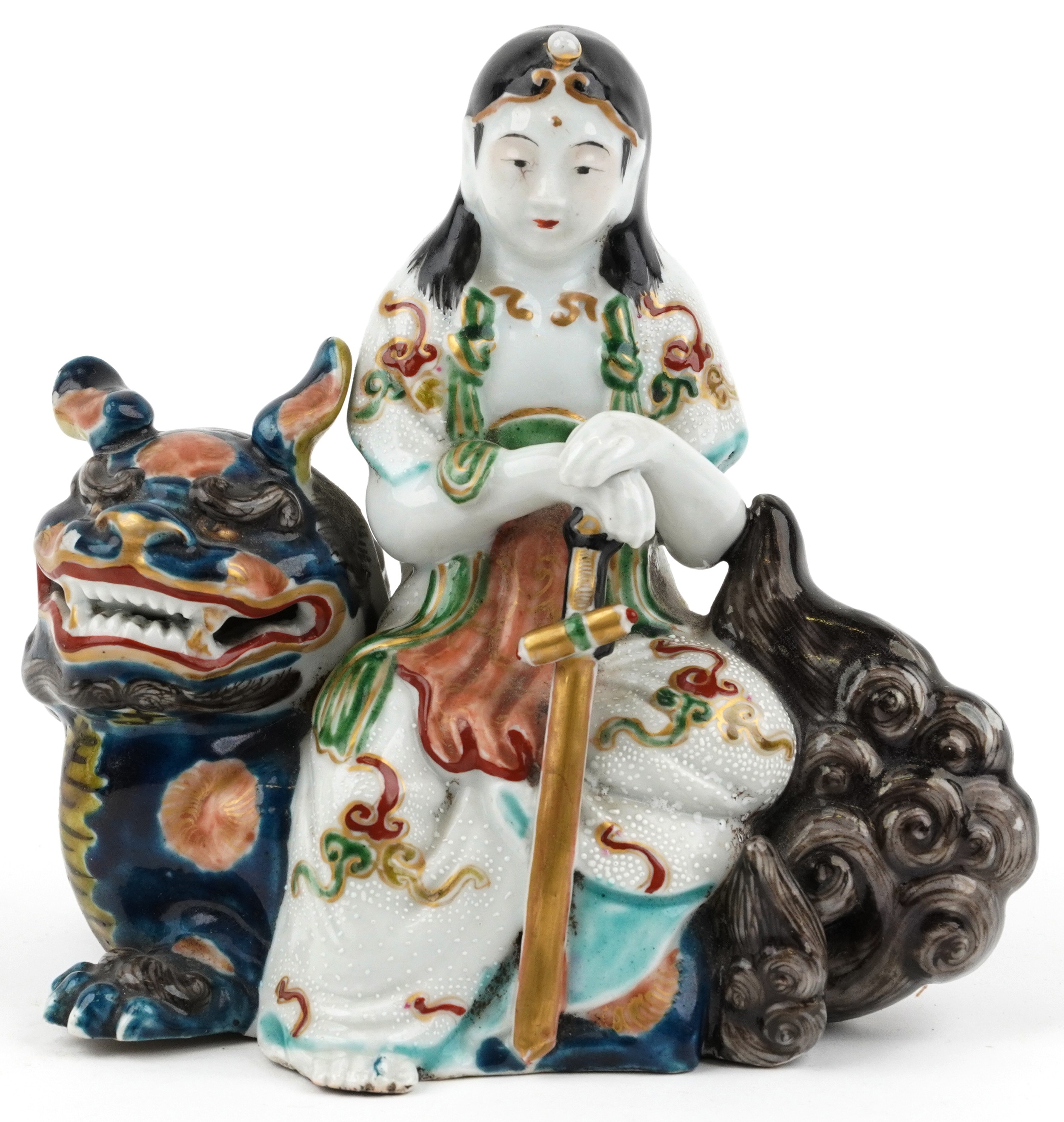 Japanese Kutani porcelain figure of a female on mythical animal, 15.5cm wide