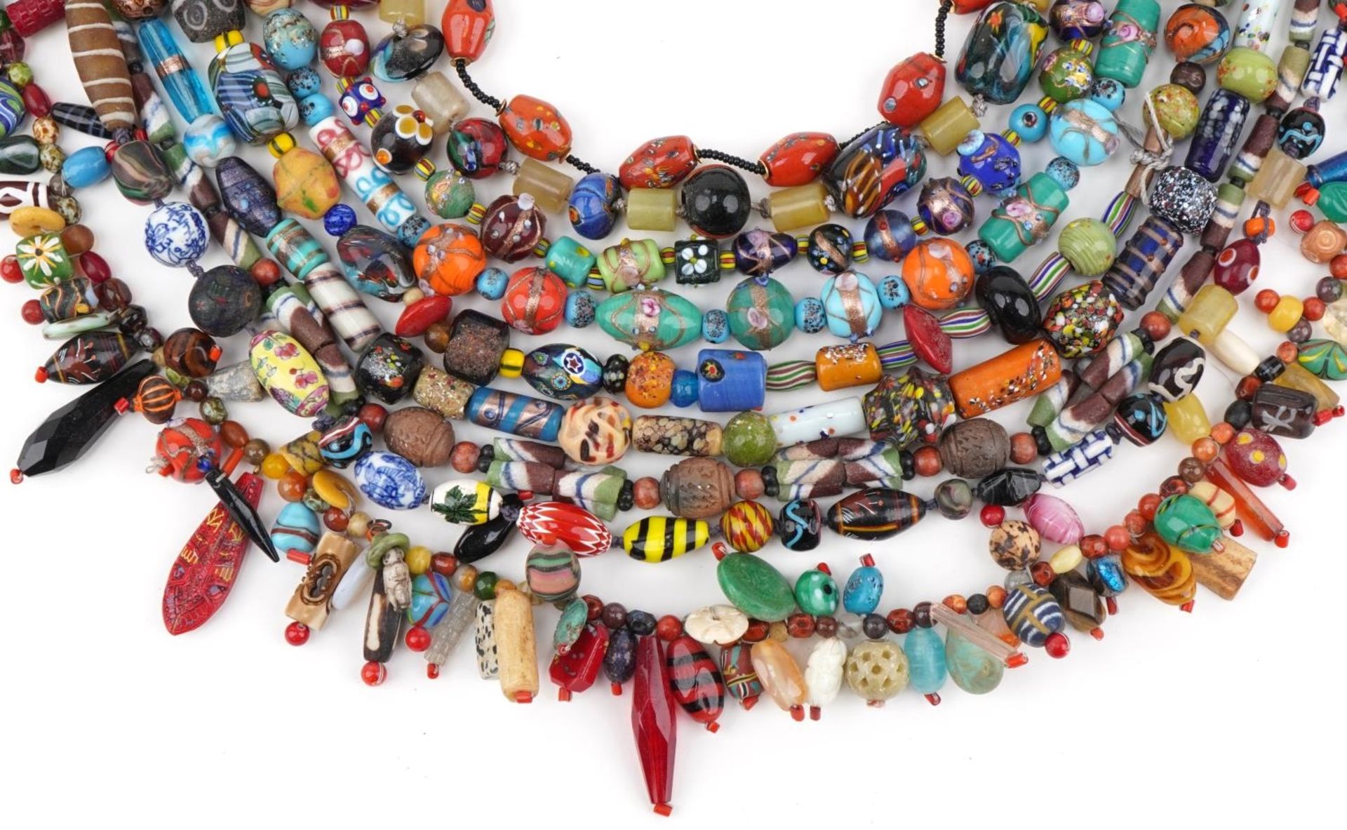 Six Murano and Bohemian glass bead necklaces and a faience glazed bead necklace, possibly Roman,
