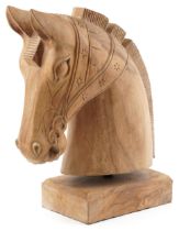 Large lightwood carving of a horsehead on a rectangular block base, 54cm high