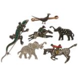 Six antique and later silver and white metal animal brooches including a pheasant set with diamonds,