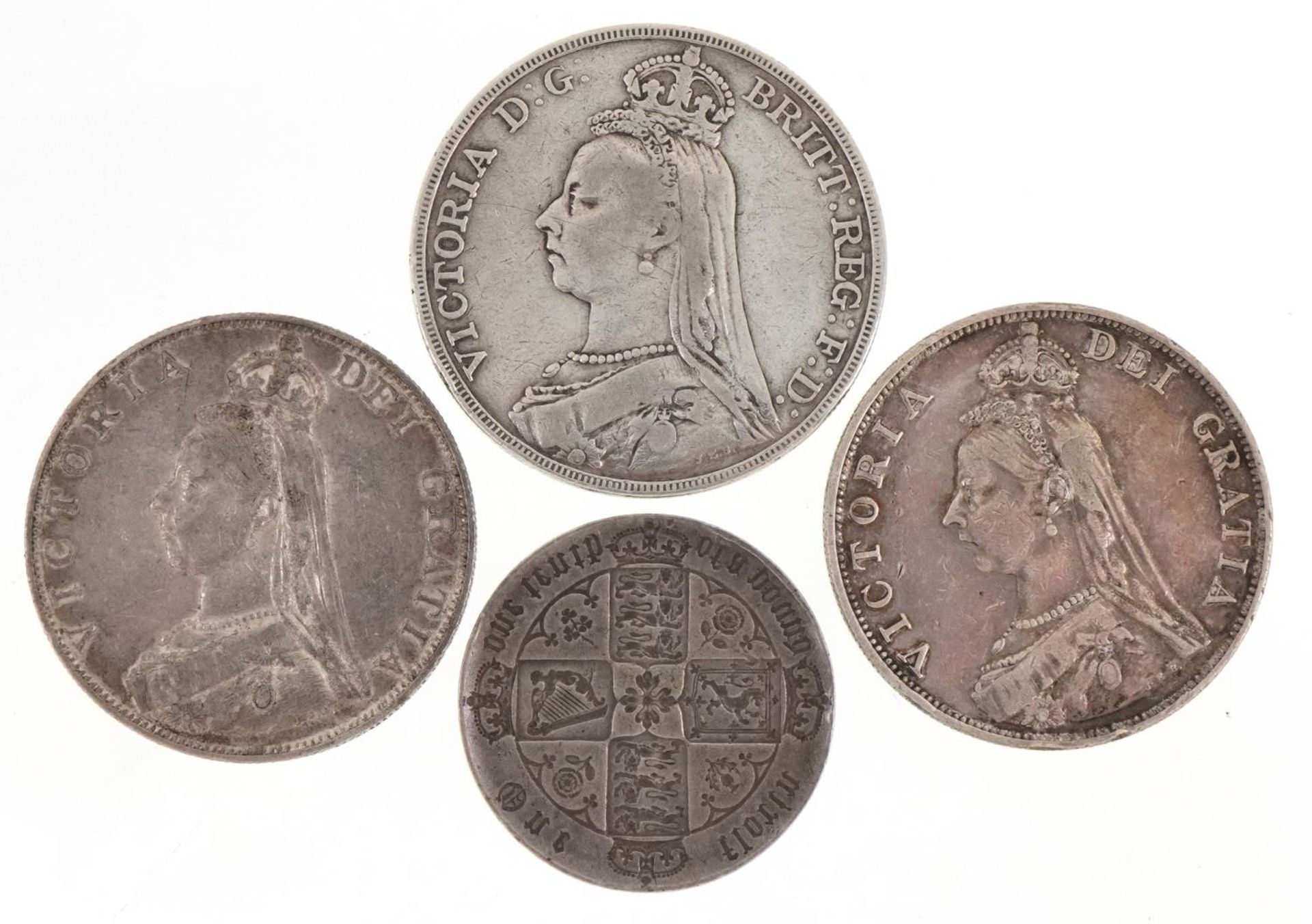 Victorian silver coins including 1892 crown, two double florins dates 1887 and 1889 and Gothic