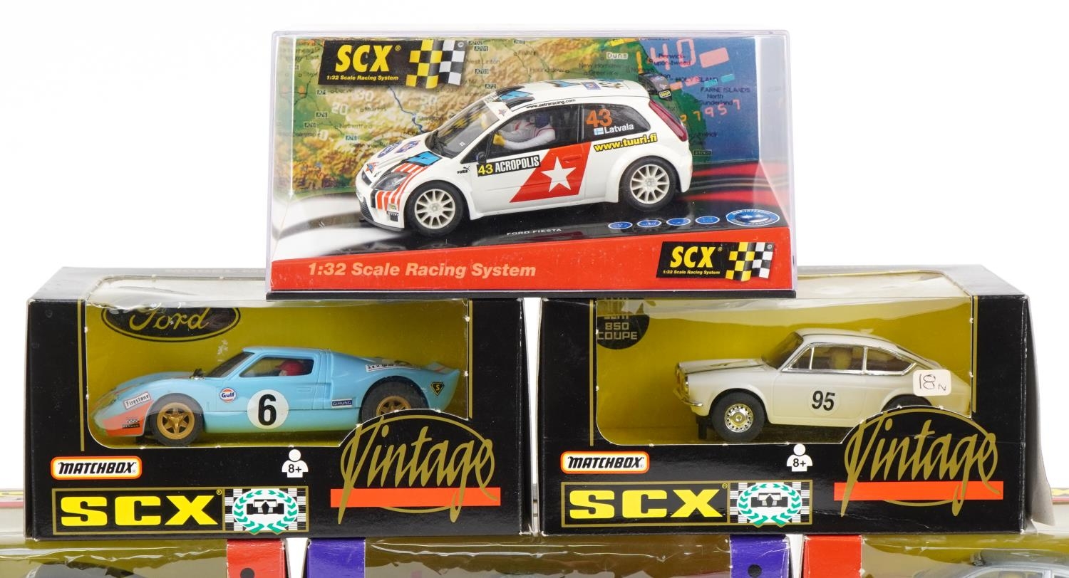 Ten Matchbox SCX 1:32 scale model slot cars with boxes and cases including Subaru Impreza, Porsche - Image 2 of 4