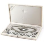 Broste, Modernist white metal jewellery suite comprising necklace, bracelet, brooch and clip on
