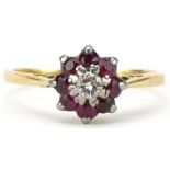 18ct gold diamond and ruby flower head ring, the diamond approximately 0.10 carat, size N, 2.6g