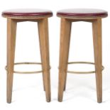 Pair of contemporary breakfast bar stools with burgundy leather upholstered padded seats, each