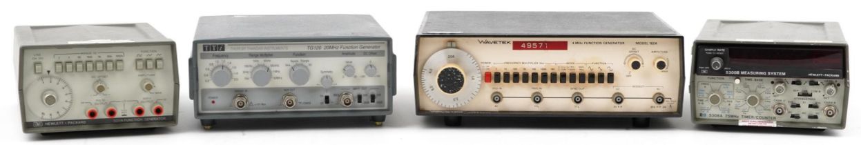 Four vintage electrical power supplies including Hewlett Packard 3311A function generator, Hewlett