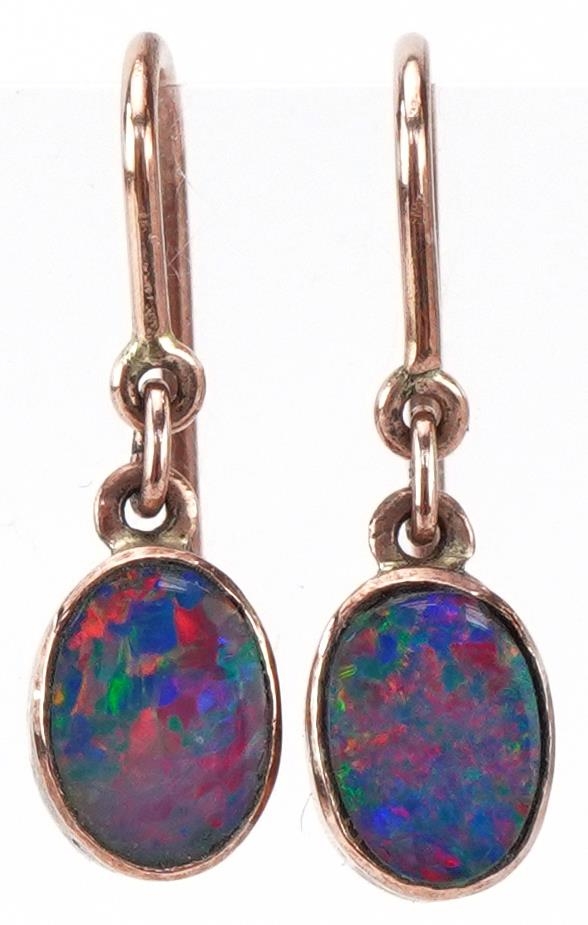 Pair of unmarked gold opal drop earrings, tests as 9ct gold, each 1.9cm high, total 1.2g