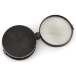 19th century unmarked silver and tortoiseshell folding magnifying glass, 6.5cm in diameter when
