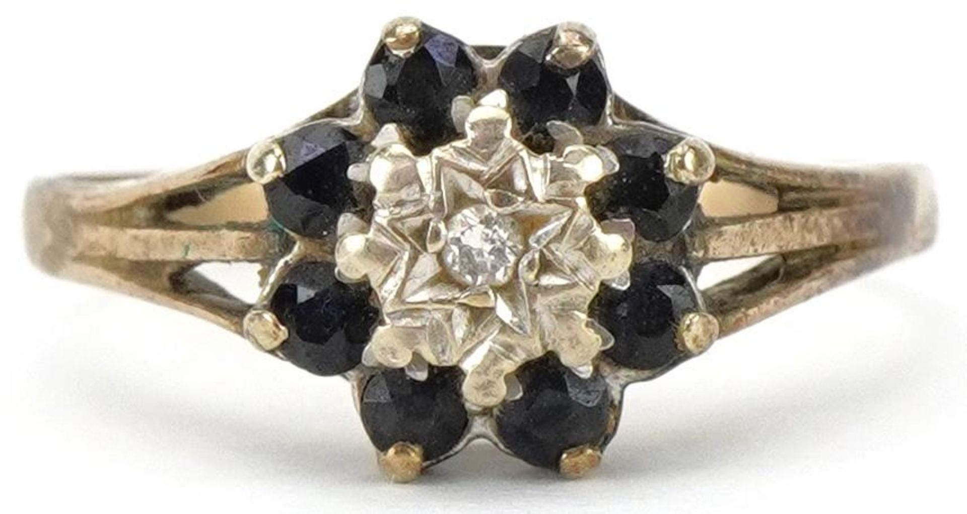 9ct gold diamond and blue spinel flower head ring, size S, 2.5g