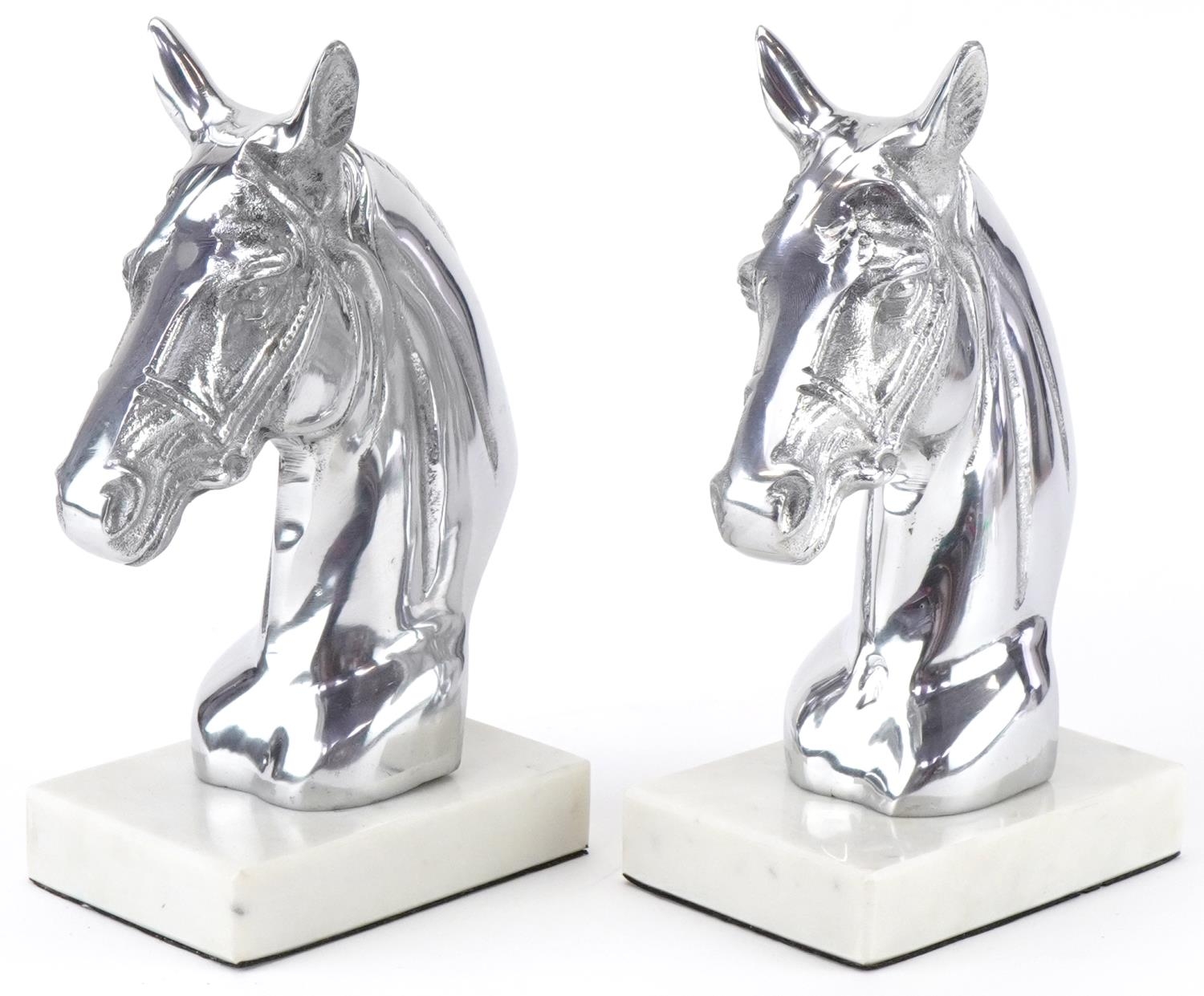 Pair of silvered metal and white marble horsehead bookends, each 23cm high