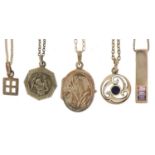 Five silver pendants on silver necklaces including floral engraved locket, St Christopher pendant