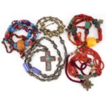 Five Asian and South American necklaces including amber coloured beads, coral and turquoise, the