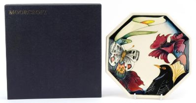 Moorcroft pottery octagonal plate with box hand painted and tubelined in the Medley pattern,