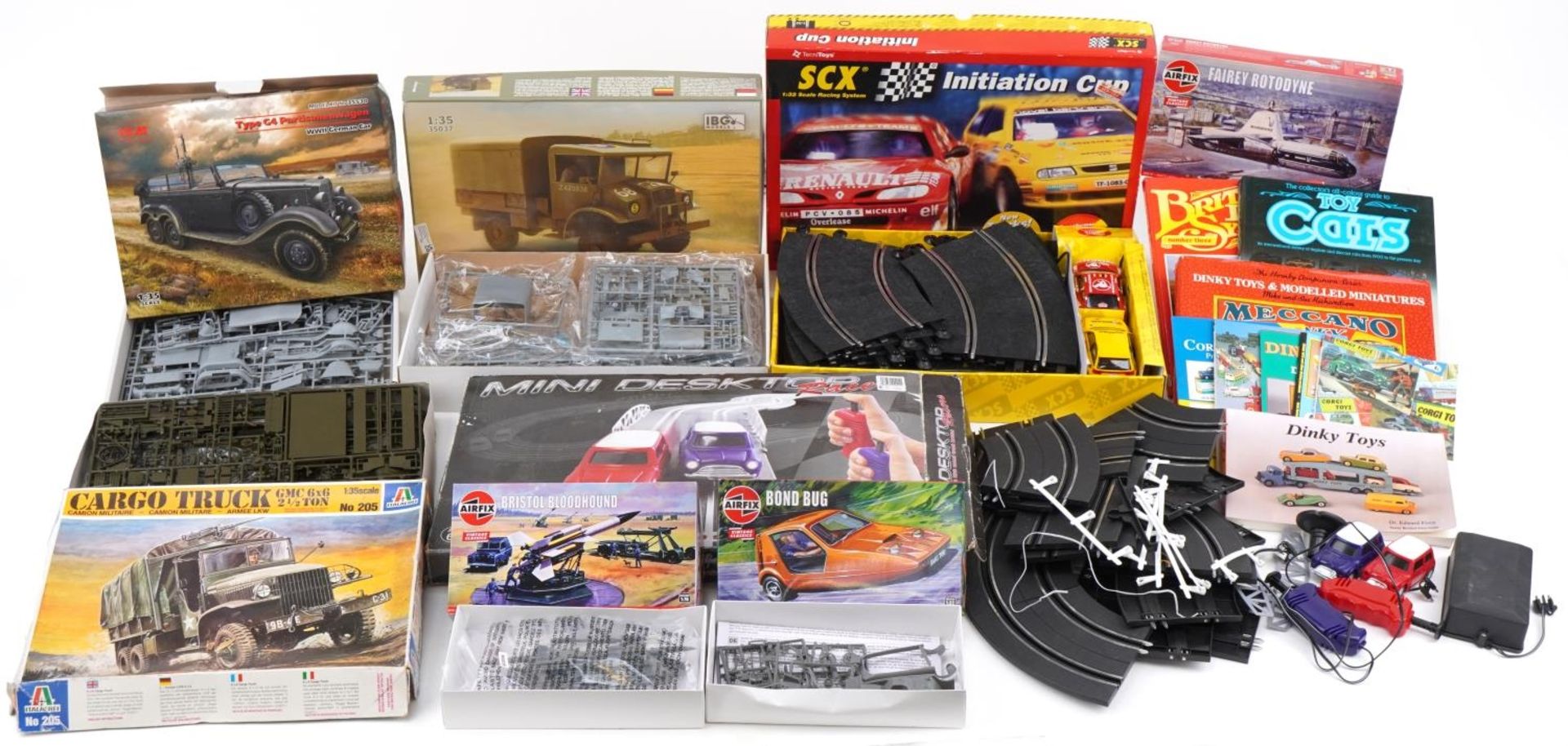 Vintage and later model kits, slot car racing tracks and toy collector's guides including SCX 1:32