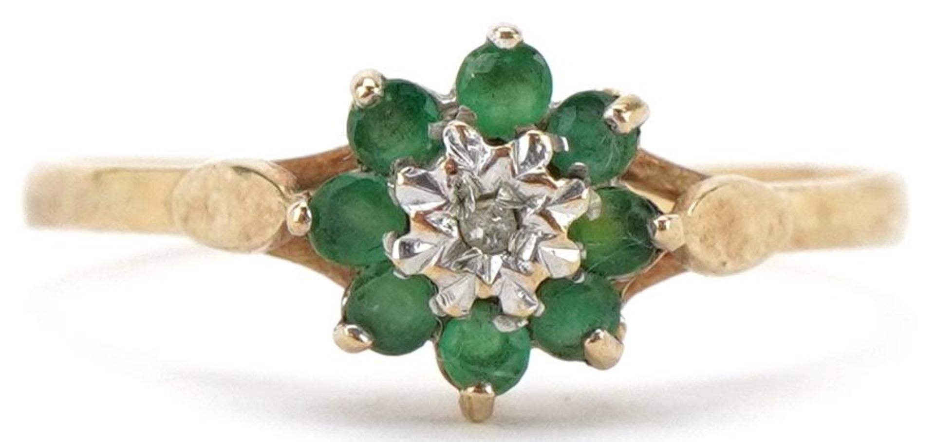 9ct gold diamond and emerald flower head ring, size P, 1.3g