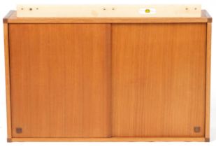 Beaver & Tapley, mid century Scandinavian design teak modular wall cupboard with a pair of sliding