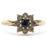 9ct gold blue spinel and clear stone flower head ring, size P, 2.0g