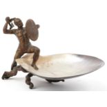 19th century gilt cast metal figure of a Mohawk warrior mounted on a mother of pearl dish, 20.5cm