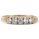 Unmarked gold cubic zirconia five stone ring, size L/M, 1.0g