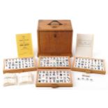 H P G & S Ltd Chinese mahjong set by Jackpot with instructions, housed in a light oak five drawer