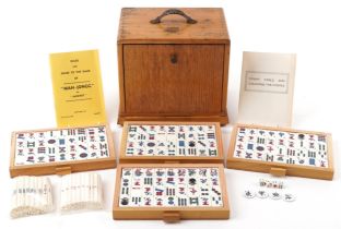 H P G & S Ltd Chinese mahjong set by Jackpot with instructions, housed in a light oak five drawer