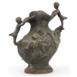 19th century classical patinated bronze jug surmounted and decorated in relief with children and