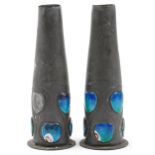 Archibald Knox for Liberty & Co, pair of Arts & Crafts Tudric pewter vases with blue enamelled heart