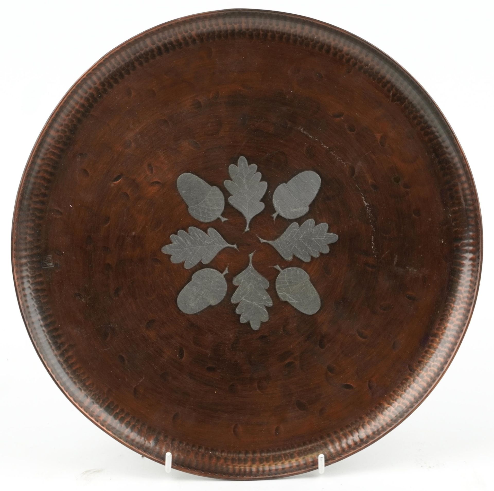 Hugh Wallis, Arts and Crafts copper, pewter inlaid acorn design tray, 27cm in diameter