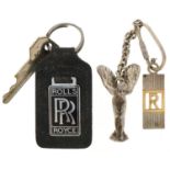Three Rolls Royce keyrings, two silver, including Spirit of Ecstasy car mascot, the figure