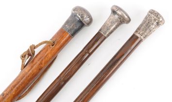 Three hardwood silver topped walking sticks with silver handles, 92cm in length