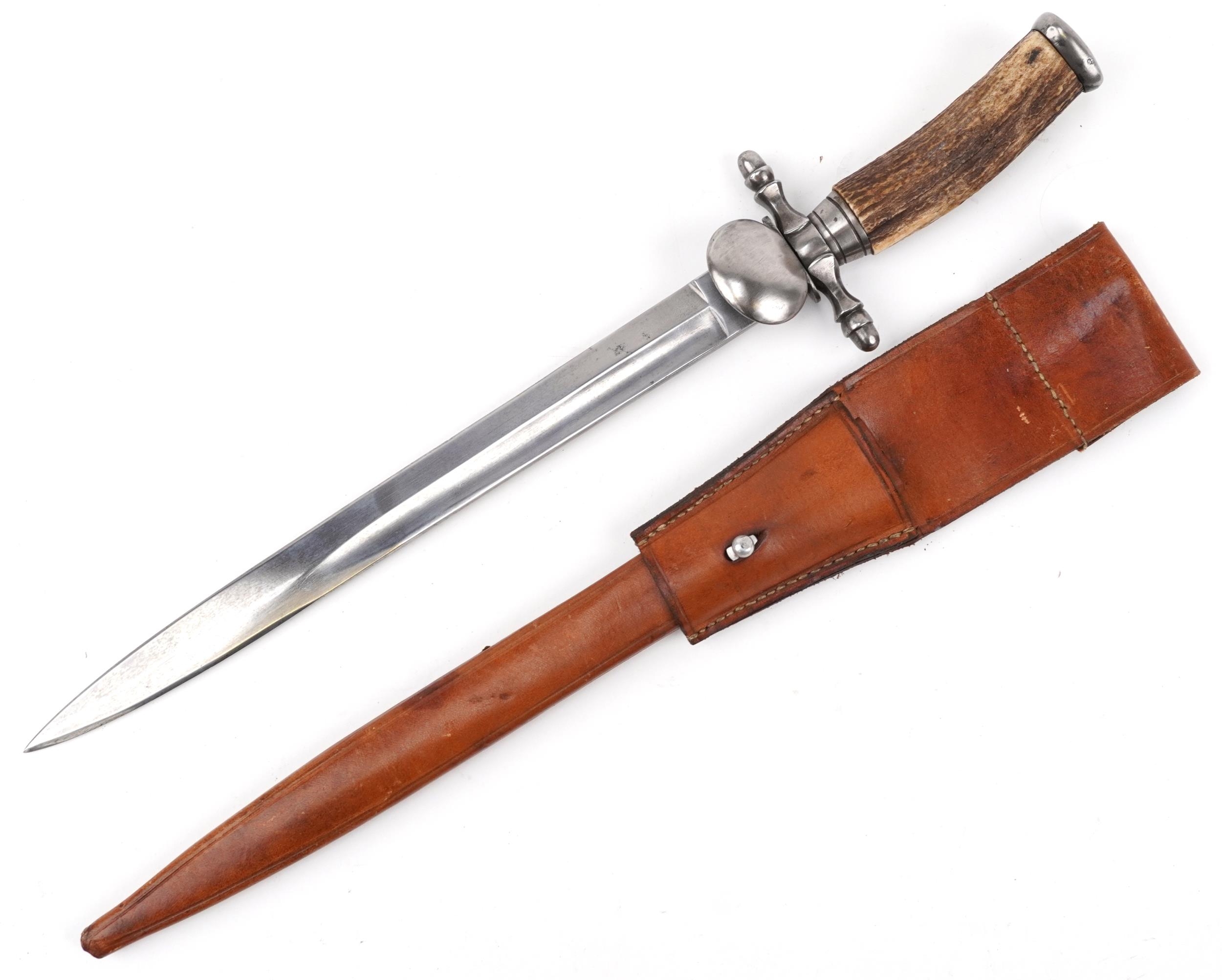 German military interest hunting knife with leather scabbard, staghorn handle and steel blade