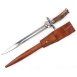 German military interest hunting knife with leather scabbard, staghorn handle and steel blade