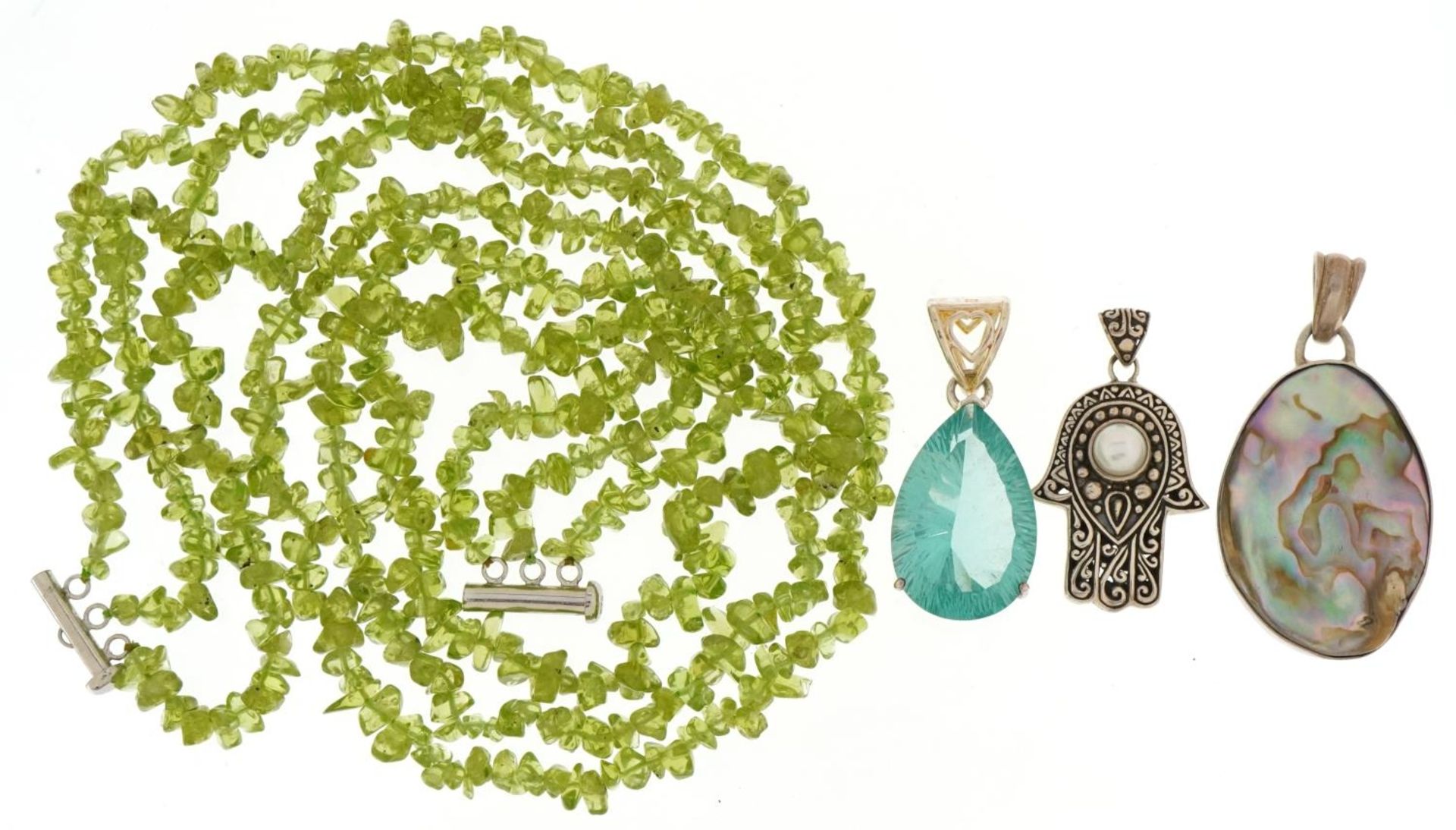 Three row green stone necklace and three silver pendants including Hand of Fatima by ATI ID, the