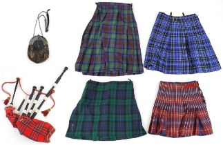 Set of Scottish interest bagpipes, various kilts and an as new sporran with stag's head