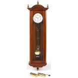 Walnut regulator wall clock striking on eight rods having a circular dial with Roman numerals, 126cm