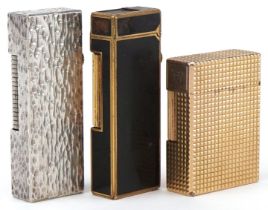 Three vintage pocket lighters, gold plated S J Dupont, silver plated Dunhill bark design and gold