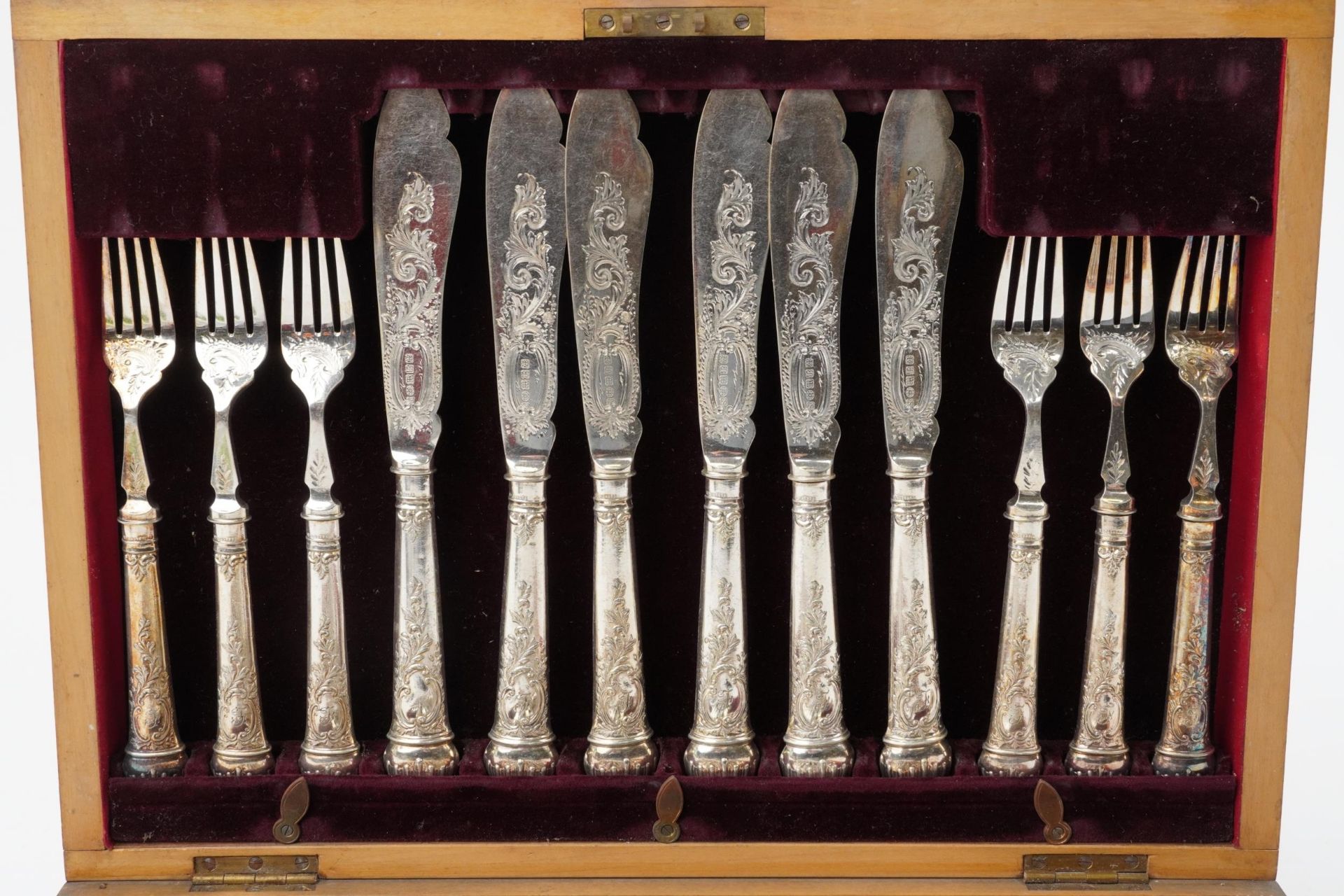 Victorian twelve place canteen of silver plated fish knives and forks engraved and embossed with - Image 3 of 8